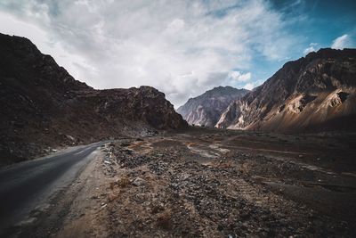 Road amidst mountains against sky