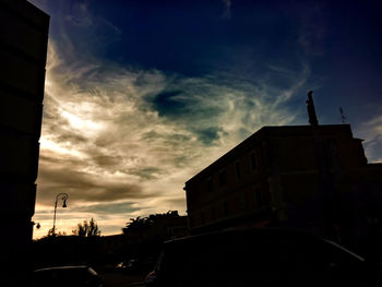 Road against cloudy sky at sunset