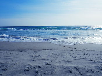 Scenic view of beach against sky