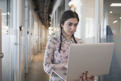 Young professional woman working on a laptop