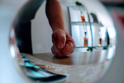 Close-up of hand holding cigarette