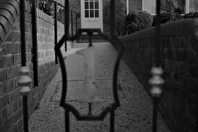 Shadow of fence on wall