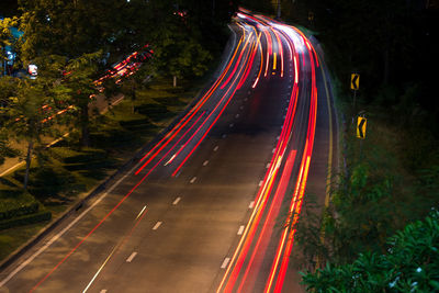High angle view of light trails on road at night
