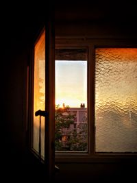 Close-up of window at sunset