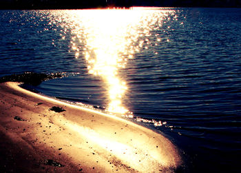 Scenic view of beach against sky during sunset