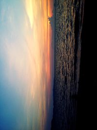 Scenic view of calm sea at sunset