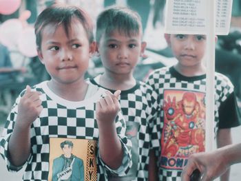 Portrait of a boy holding hands