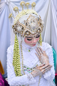 Portrait of woman wearing traditional wedding clothing