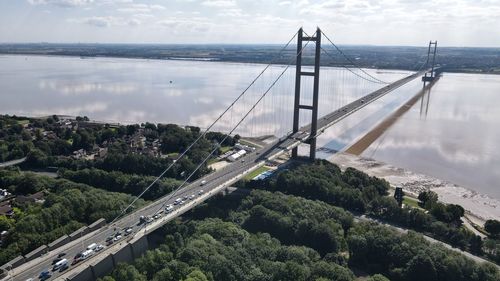 High angle view of bridge and cityscape against sky