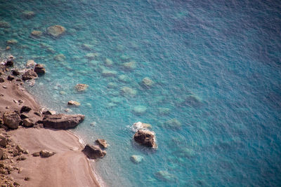 High angle view of rocks on sea