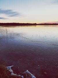 Scenic view of frozen lake against sky