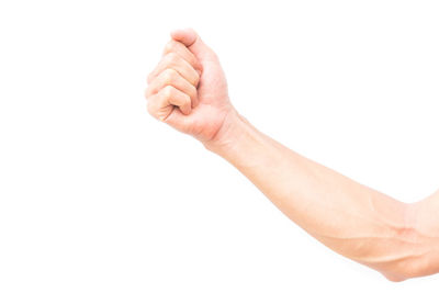 Close-up of human hand against white background