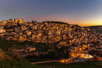 Aerial view of city buildings during sunset