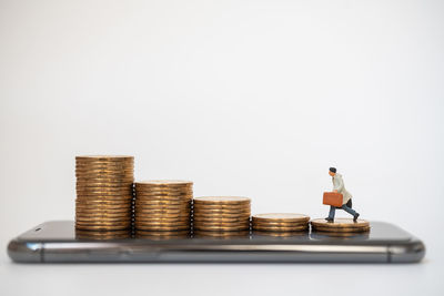 Stack of objects on table against white background