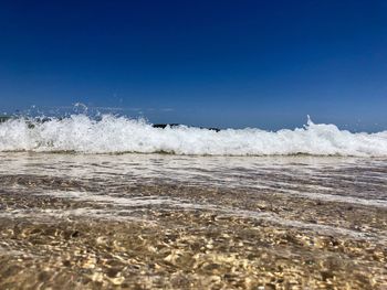 Scenic view of sea against clear sky