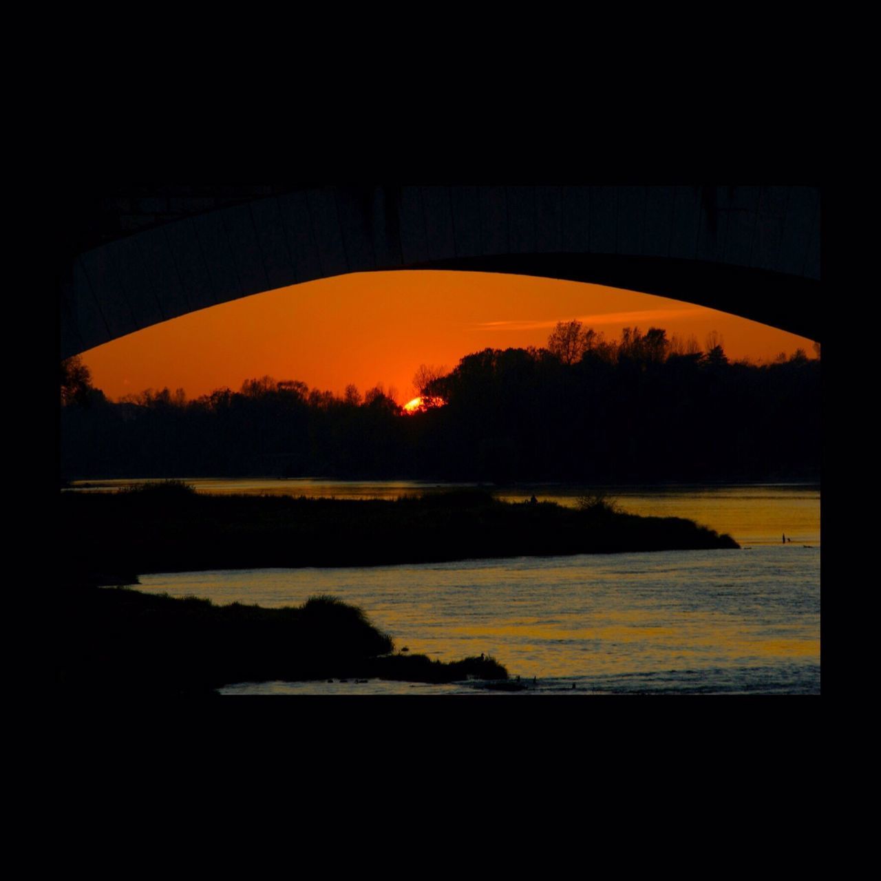 sunset, water, reflection, orange color, silhouette, sky, scenics, beauty in nature, tranquility, tranquil scene, river, lake, transportation, nature, tree, sun, sunlight, idyllic, no people, yellow