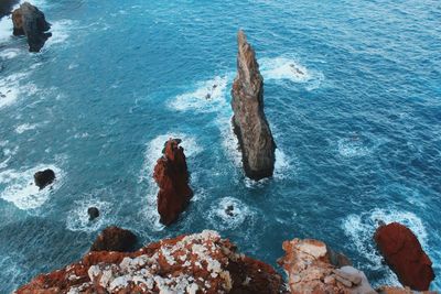 High angle view of rock formation in sea