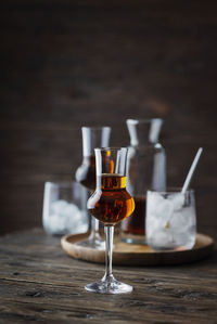 Close-up of wine glasses on table