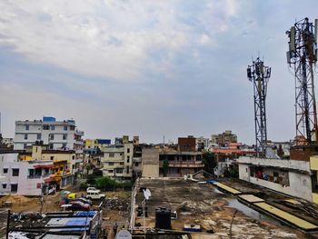 High angle view of buildings in city against sky