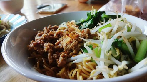 Close-up of noodles in bowl on table