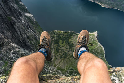 Low section of man legs on rock