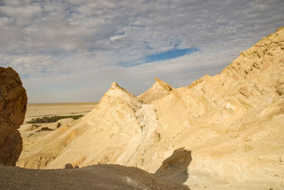 Panoramic view of desert against sky