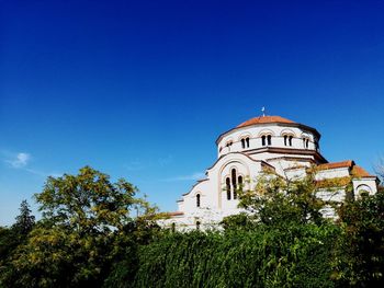 Low angle view of cathedral against clear blue sky