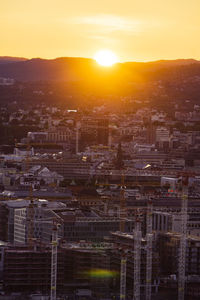 High angle view of buildings against sky during sunset