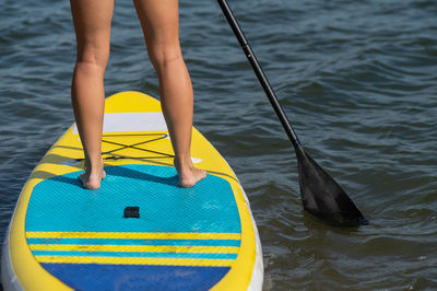 Low section of man in boat in sea