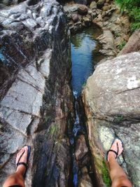 Low section of people standing on rock