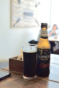 Close-up of beer glass on table