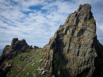 Low angle view of rock formations against sky