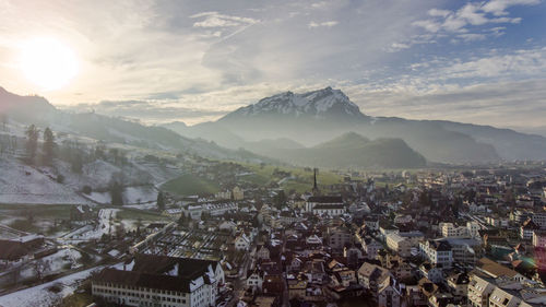 High angle view of townscape against cloudy sky