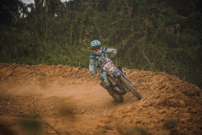 Man riding motorcycle on land