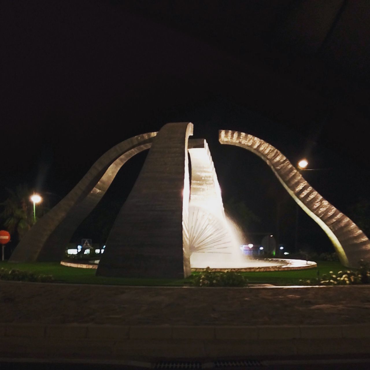 illuminated, night, built structure, architecture, lighting equipment, bridge - man made structure, connection, the way forward, street light, railing, building exterior, light - natural phenomenon, transportation, low angle view, city, modern, dark, clear sky, copy space, engineering