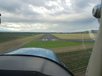 View of landscape against cloudy sky