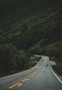 Empty road by mountain