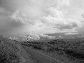 Road amidst landscape against sky