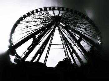 Low angle view of ferris wheel against sky