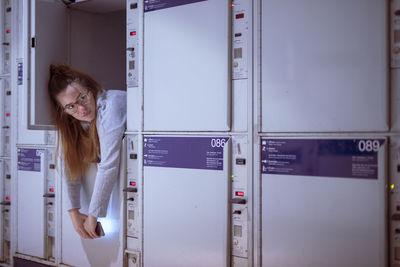 Young woman relaxing in locker