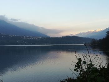 Scenic view of lake against sky during sunset