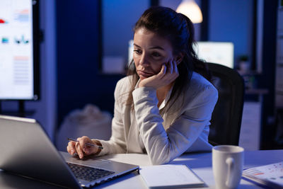 Businesswoman working at desk in office