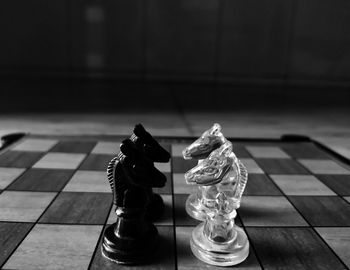 Close-up of chess pieces on floor