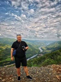 Full length of man on mountain against sky