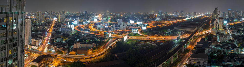 High angle view of city lit up at night