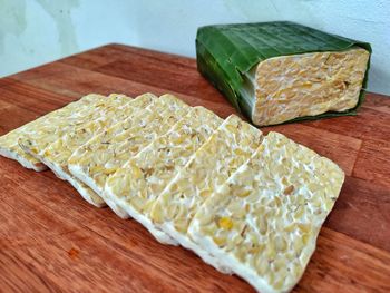 High angle view of chopped bread on cutting board