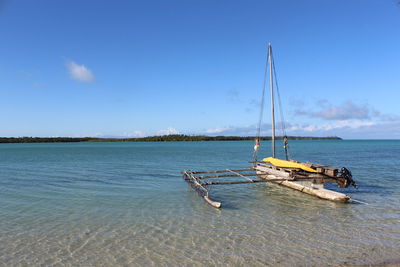 Outrigger boat moored at beach