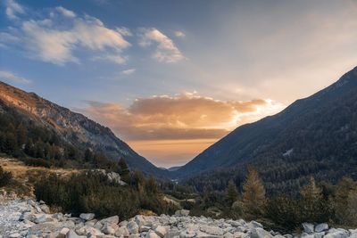 Scenic view of snowcapped mountains against sky during sunset