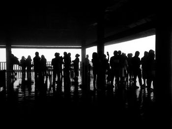 Silhouette people in corridor