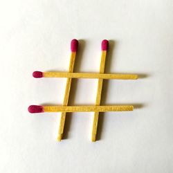 High angle view of colored pencils on white background